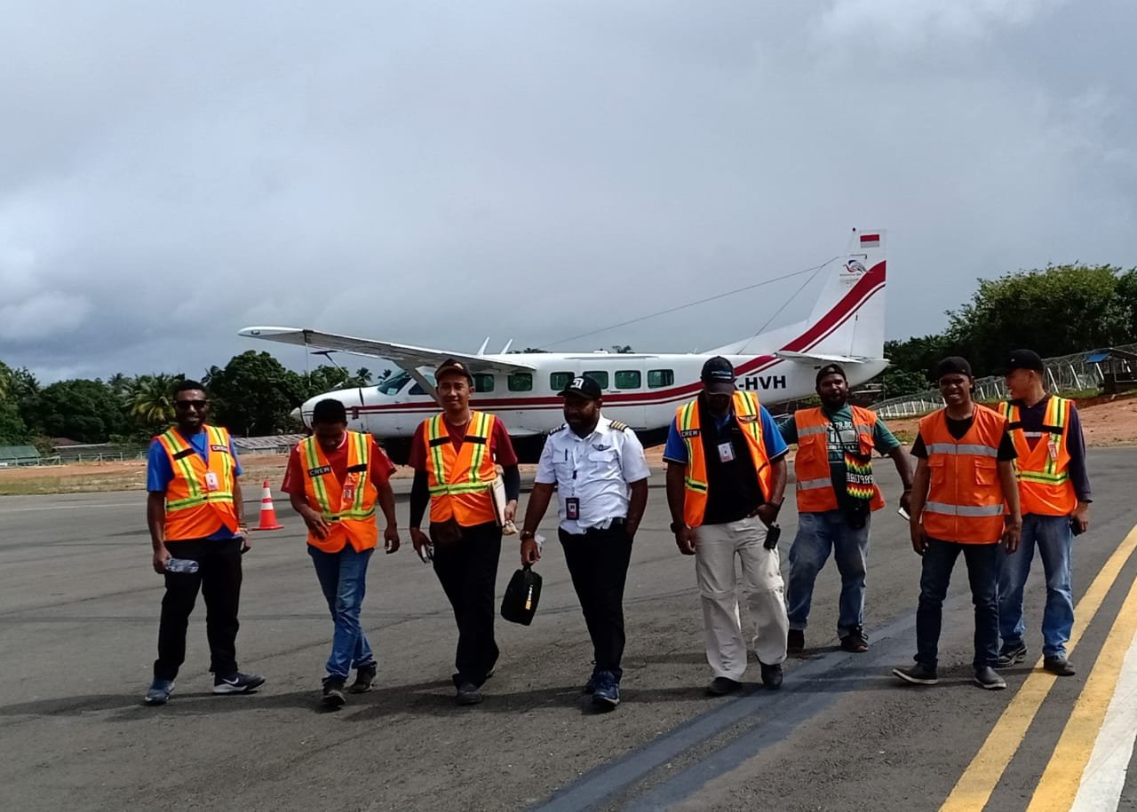 Ikairos flight and ground crew walking on the ramp
